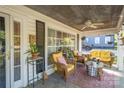 Cozy front porch with comfortable seating and ceiling fan, great for entertaining guests at 412 W D Ave, Salisbury, NC 28144