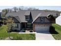 Charming home featuring a two-car garage, manicured lawn, and elegant brick and siding accents at 4425 Marlay Park, Indian Trail, NC 28079