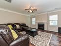 Comfortable living room with a fireplace, plush seating, and a cozy atmosphere at 4425 Marlay Park, Indian Trail, NC 28079