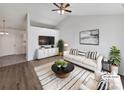 Bright living room with neutral walls, modern furniture, and a cozy rug creating a relaxing atmosphere at 5407 Windy Valley Dr, Charlotte, NC 28208