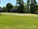Scenic view of the home backing onto a lush green golf course at 6144 Abergele Ln, Matthews, NC 28104