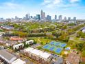 Aerial view of townhome community near downtown Charlotte featuring tennis courts and tree-lined streets at 837 Seigle Point Dr, Charlotte, NC 28204