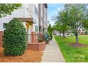 Street view of townhomes with well-maintained sidewalks and landscaping leading to inviting front entrances at 837 Seigle Point Dr, Charlotte, NC 28204