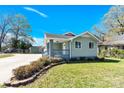 Quaint light green home with a gray porch and walkway to the front door at 109 Broad St, Shelby, NC 28152