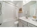 Clean bathroom with white tiled walls, a bathtub, and a modern vanity at 11036 Shreveport Dr, Huntersville, NC 28078
