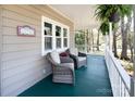 Inviting front porch with comfortable seating area perfect for relaxing outdoors at 11901 Rock Canyon Dr, Charlotte, NC 28226