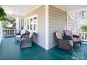 Spacious front porch with cozy seating, perfect for enjoying the outdoors at 11901 Rock Canyon Dr, Charlotte, NC 28226