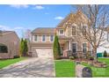 Charming two-story home featuring a well-manicured lawn and a two-car garage, nestled in a suburban neighborhood at 1504 Ridge Haven Rd, Waxhaw, NC 28173