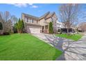Inviting two-story home with a well-kept lawn and a spacious driveway leading to a convenient two-car garage at 1504 Ridge Haven Rd, Waxhaw, NC 28173