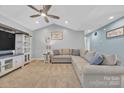 Inviting living room with vaulted ceiling, plush sectional sofa, and neutral color palette at 1584 Beverly Ln, Lincolnton, NC 28092