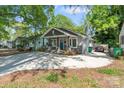 Exterior shot of a lovely home with a well-maintained front yard and concrete driveway at 2117 Camp Greene St, Charlotte, NC 28208