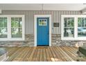Close-up of the home's front porch with a welcoming blue door and stone accents at 2117 Camp Greene St, Charlotte, NC 28208