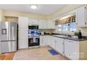 Bright kitchen featuring white cabinetry, stainless steel appliances, and a window over the sink at 3846 22Nd Ne St, Hickory, NC 28601
