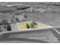 Aerial view showcasing the property's approximate lot lines, home, trees, and surrounding landscape at 396 Tower Rd, Vale, NC 28168