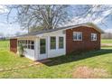 The sunroom has white walls, and the house is brick, providing abundant natural light at 396 Tower Rd, Vale, NC 28168