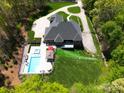 Areal view showing luxurious backyard oasis with a swimming pool, spa, and cabana at 4071 King Wilkinson Rd, Lincolnton, NC 28092