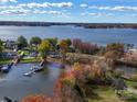 Picturesque aerial view of a lakefront property with mature trees and docks, showcasing the waterfront lifestyle at 4980 Kiser Island Rd, Terrell, NC 28682