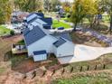 Spacious backyard with a deck and outdoor seating, backing up to a street in a residential neighborhood at 4980 Kiser Island Rd, Terrell, NC 28682