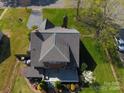 Aerial view of a well-maintained house featuring a new roof, a spacious backyard, and mature trees at 601 Meadowbrook Rd, Kings Mountain, NC 28086
