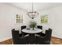 Bright dining area featuring a stylish marble table and modern light fixture at 6614 Old Providence Rd, Charlotte, NC 28226