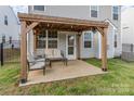 Inviting back patio with a pergola, perfect for outdoor relaxation at 7394 Echoing Hills Ln, Maiden, NC 28650