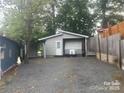 Exterior view of house with gravel parking at 128 Twin Bluff Trl # C52, Mount Gilead, NC 27306