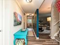 Bright and inviting hallway with hardwood floors and stylish decor throughout the home at 1615 Merry Oaks Rd # G, Charlotte, NC 28205