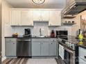 Modern kitchen features stainless steel appliances, granite countertops, and subway tile backsplash at 1615 Merry Oaks Rd # G, Charlotte, NC 28205