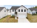 Charming two-story home with a two-car garage and well-maintained landscaping enhancing its curb appeal at 1976 Ethan Ln, Stanfield, NC 28163