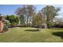 Large, well-manicured backyard with storage shed and plenty of space for outdoor activities at 2064 Elizabeth Ave, Hickory, NC 28602