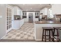 Bright kitchen featuring white cabinets, stainless steel appliances, and beautiful flooring at 2064 Elizabeth Ave, Hickory, NC 28602