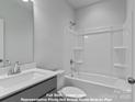 Full bathroom with shower and tub combination, plus a modern vanity at 212 Gilead Rd, Huntersville, NC 28078