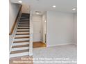 Bright entry foyer with staircase and access to lower-level flex room at 212 Gilead Rd, Huntersville, NC 28078