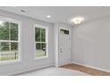 Versatile flex room with natural light, ideal for an office or den at 212 Gilead Rd, Huntersville, NC 28078