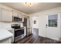 Updated kitchen features stainless steel appliances, gray cabinetry, and a convenient layout at 2741 Cowles Rd, Charlotte, NC 28208