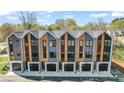 A row of modern townhouses showcasing unique architectural design and attached garages at 3441 Byrnes St, Charlotte, NC 28205