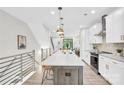 Modern kitchen showcasing a spacious island with counter seating and stylish pendant lights at 3441 Byrnes St, Charlotte, NC 28205