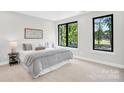 Serene bedroom featuring large windows, soft colors, and modern furnishings with natural light at 3441 Byrnes St, Charlotte, NC 28205