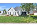 Lovely single-story home with a manicured lawn, appealing landscaping, and classic architectural design at 3701 Arthur St, Indian Trail, NC 28079
