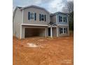 Charming two-story home featuring a welcoming facade and an attached two car garage awaiting customization at 436 Phifer Rd, Kings Mountain, NC 28086