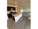 Modern kitchen features an island with granite countertops and stainless steel appliances at 438 Phifer Rd, Kings Mountain, NC 28086