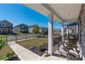 View from the front porch showcasing the neighborhood, manicured lawn, sidewalk, and curb appeal at 504 Cranford Dr, Pineville, NC 28134