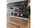 Open concept living room features custom shelving and modern design elements at 6423 Town Hall Pl, Harrisburg, NC 28075