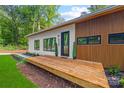 Charming modern home featuring a spacious wood porch and eye-catching curb appeal at 6548 Emerald Isle Dr, Sherrills Ford, NC 28673