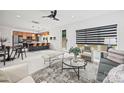 Bright, open-concept living area with modern furnishings and seamless flow to the kitchen at 6548 Emerald Isle Dr, Sherrills Ford, NC 28673