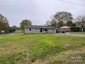 Exterior shot of the home with a landscaped front yard at 8124 Wood St, Mount Pleasant, NC 28124