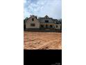New construction home with a modern farmhouse exterior and a large front yard, beautiful windows at 1204 Sage Pine Cir, Clover, SC 29710