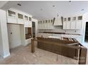 Unfinished kitchen features cabinets, an island, and modern amenities ready for customization at 1204 Sage Pine Cir, Clover, SC 29710