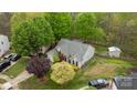 Aerial view of the property showcasing the home's layout, landscaping, and surrounding neighborhood at 12804 Lismorre Castle Ct, Charlotte, NC 28273