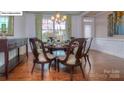 Formal dining room with hardwood floors, stylish lighting, and elegant decor at 158 Ventor Way, Mooresville, NC 28115